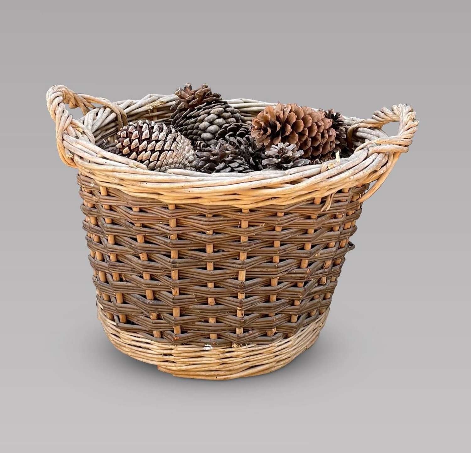 An Attractive Small Round Wicker Basket with Handles