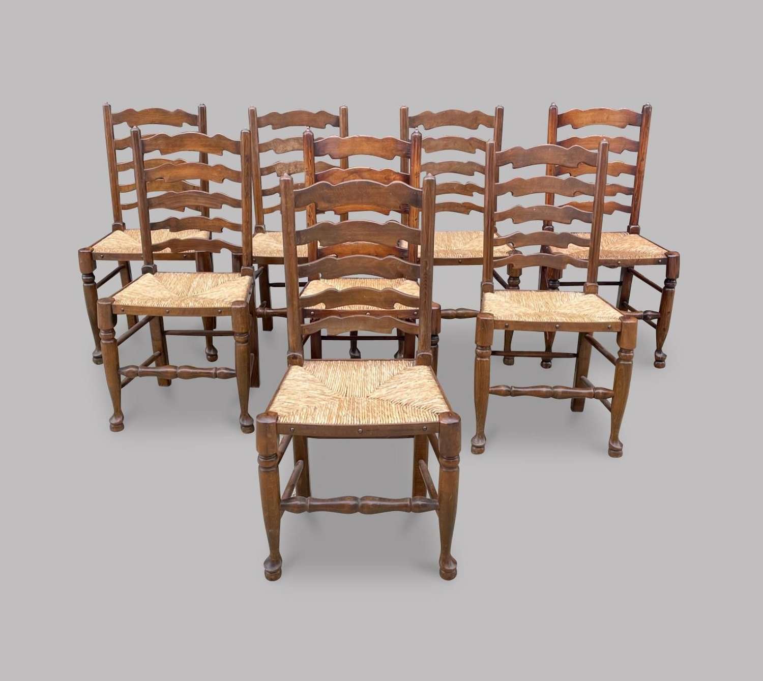 A Set of Eight Ladderback Chairs