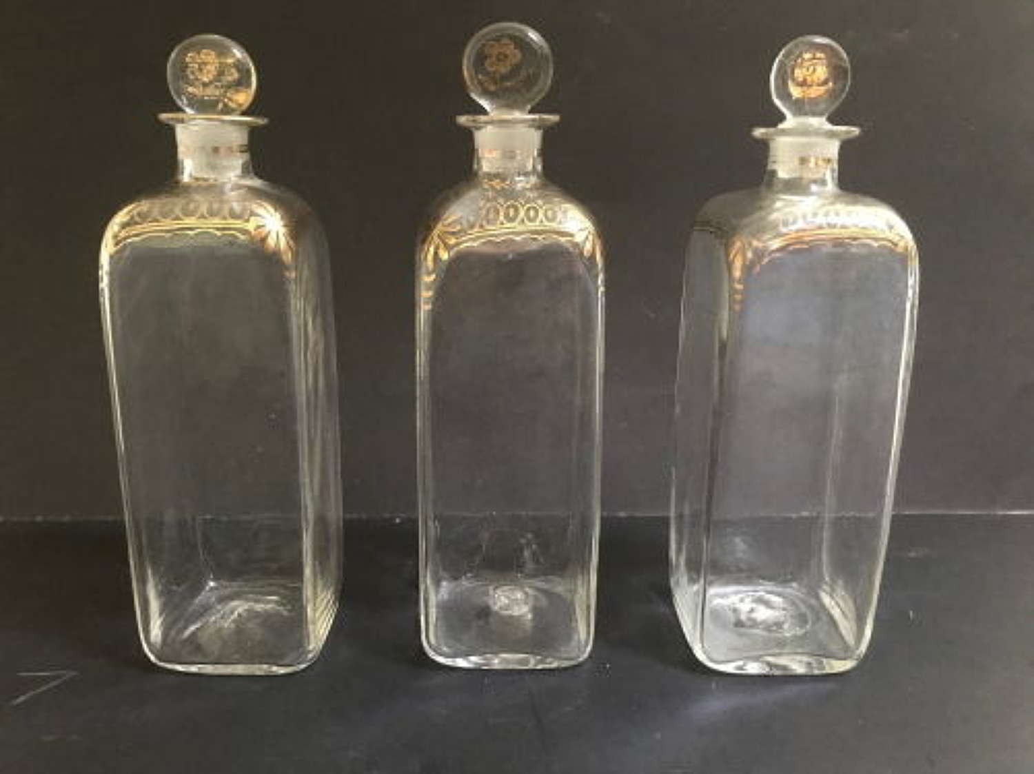 Set of Three Gilded Bottles with Stoppers