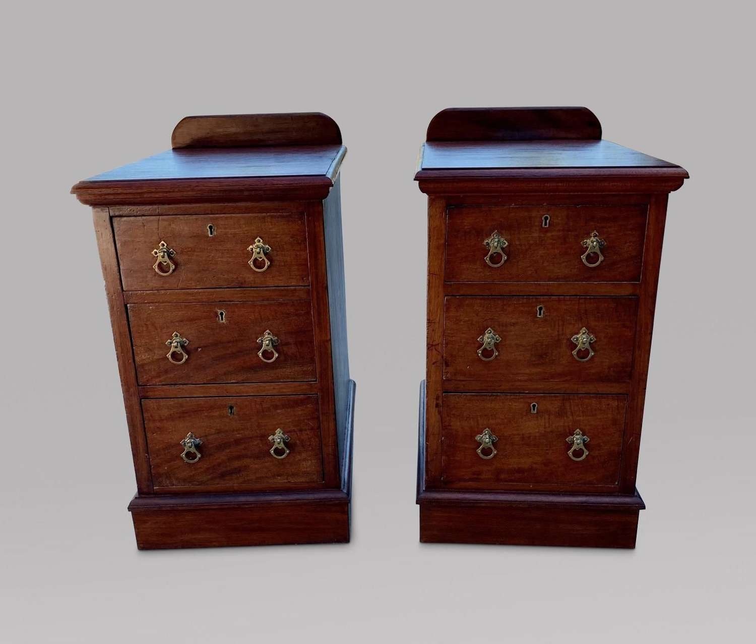 Pair of Three Drawer Mahogany Bedside Tables