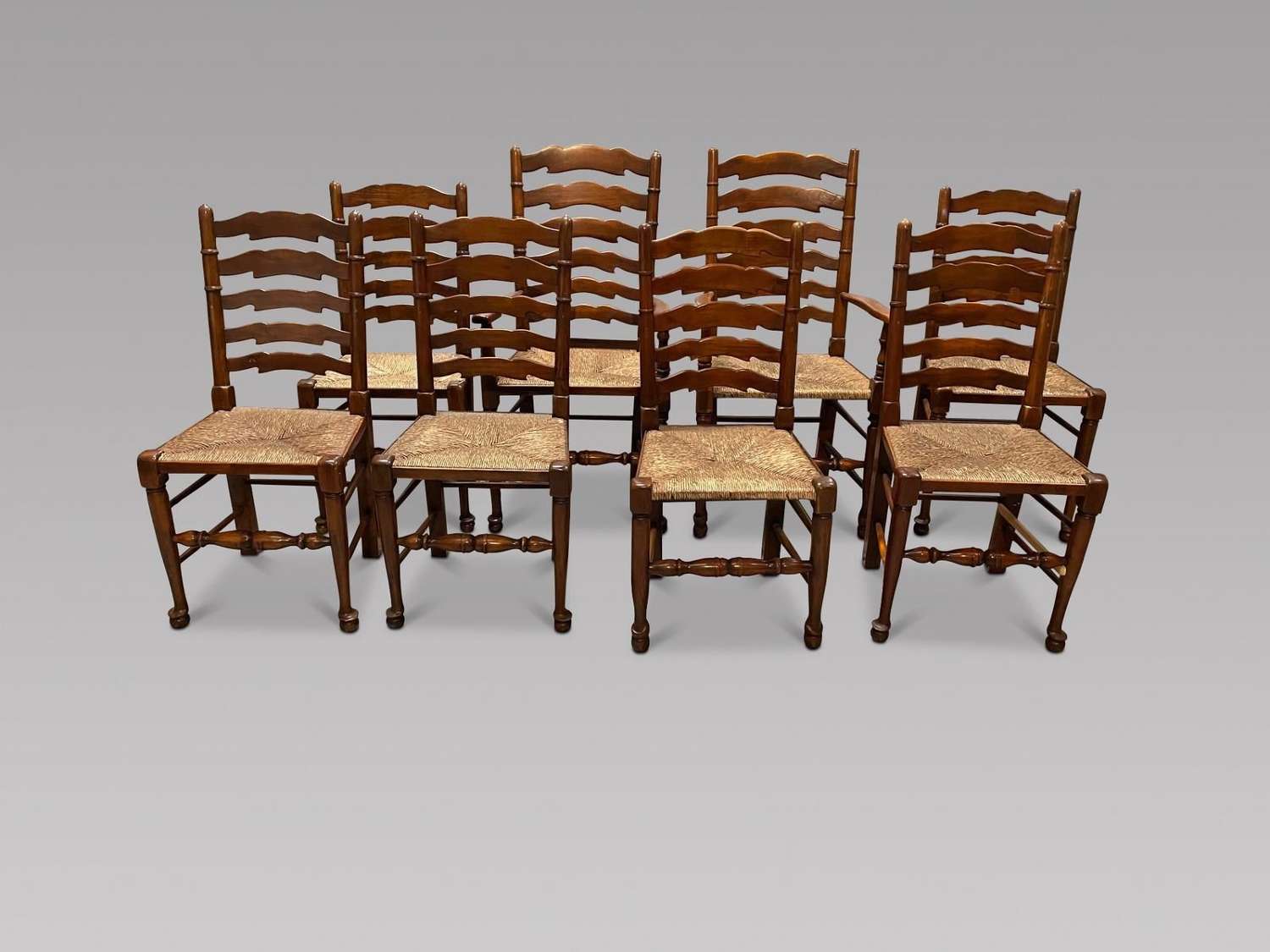 Set of Eight Ladderback Chairs with Two Carvers