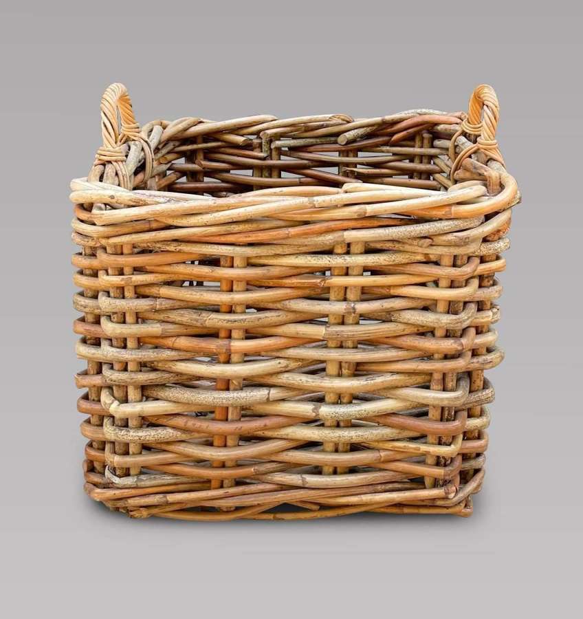 A Medium Sized Wicker Basket with Handles