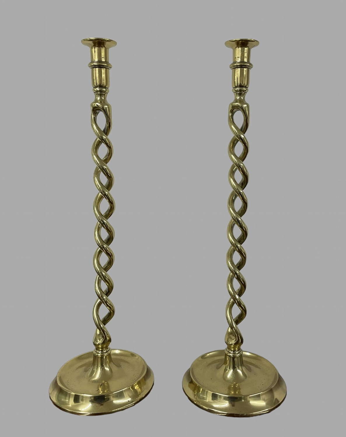 A Pair Of Brass Candlesticks
