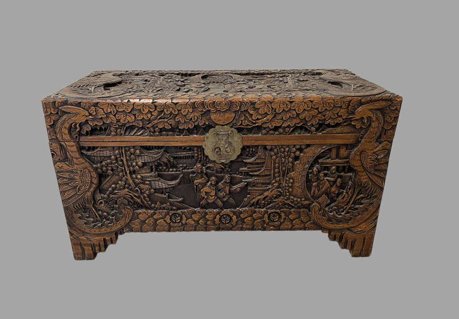 A Chinese Heavily Carved Camphorwood Box