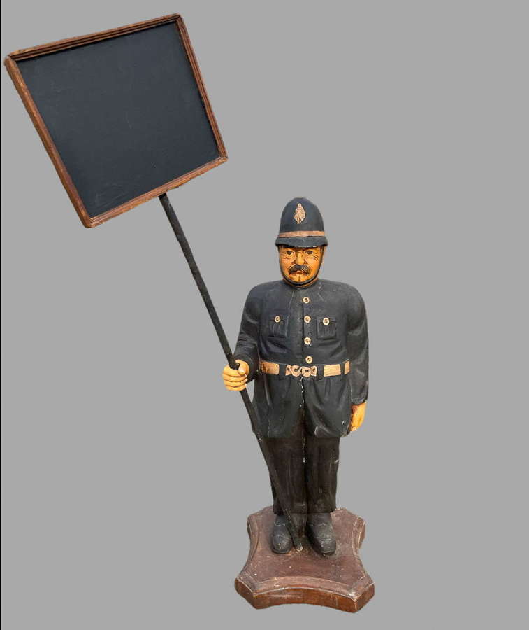 An Unusual Wooden Painted Policeman