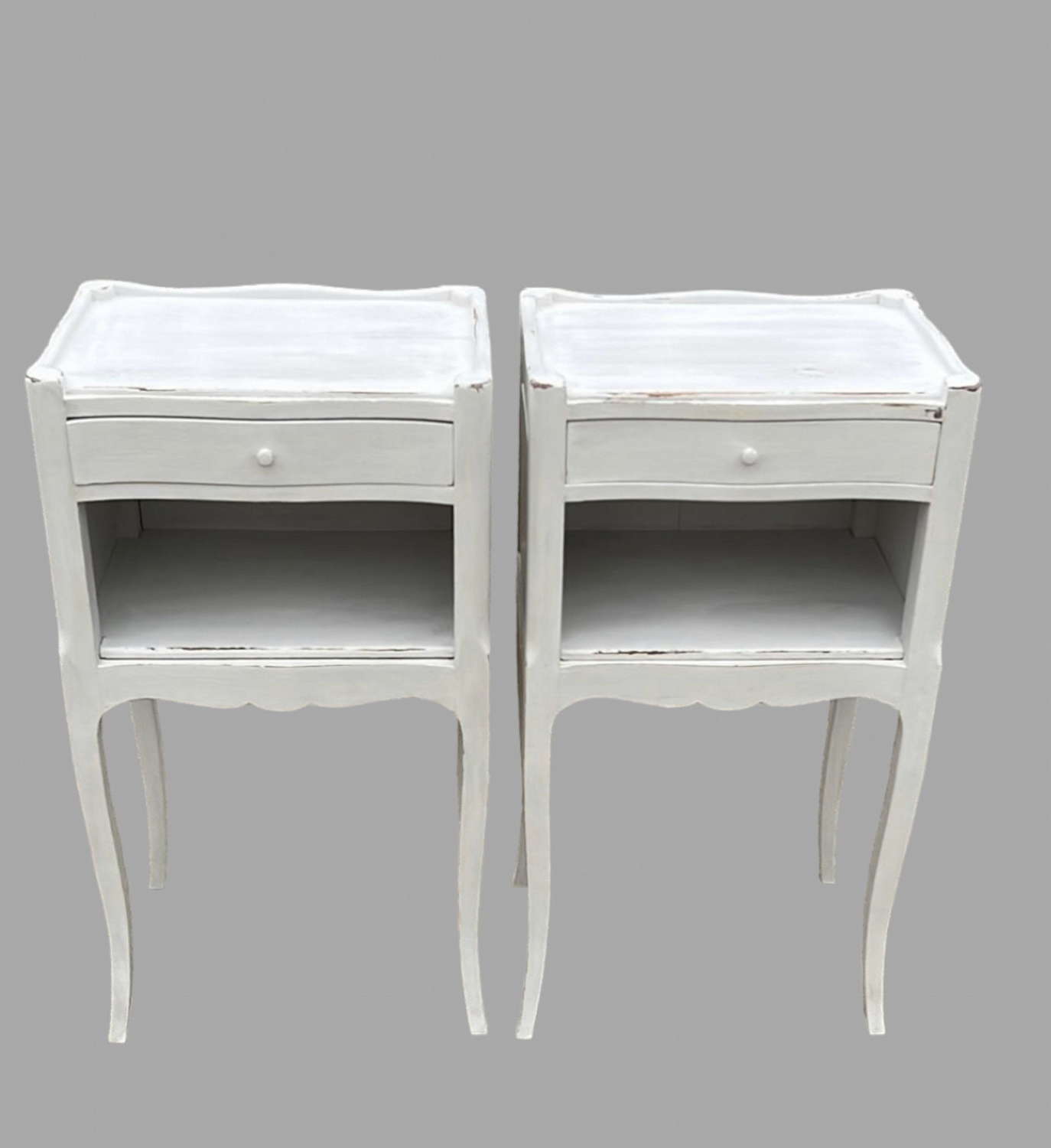 A Pair of French Painted Bedside Tables