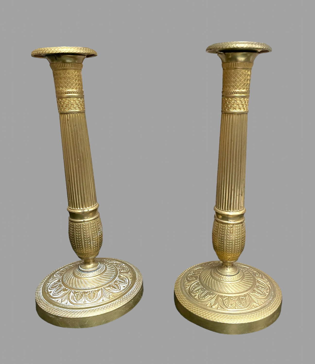 A Pair of French Gilt Brass Empire Candlesticks