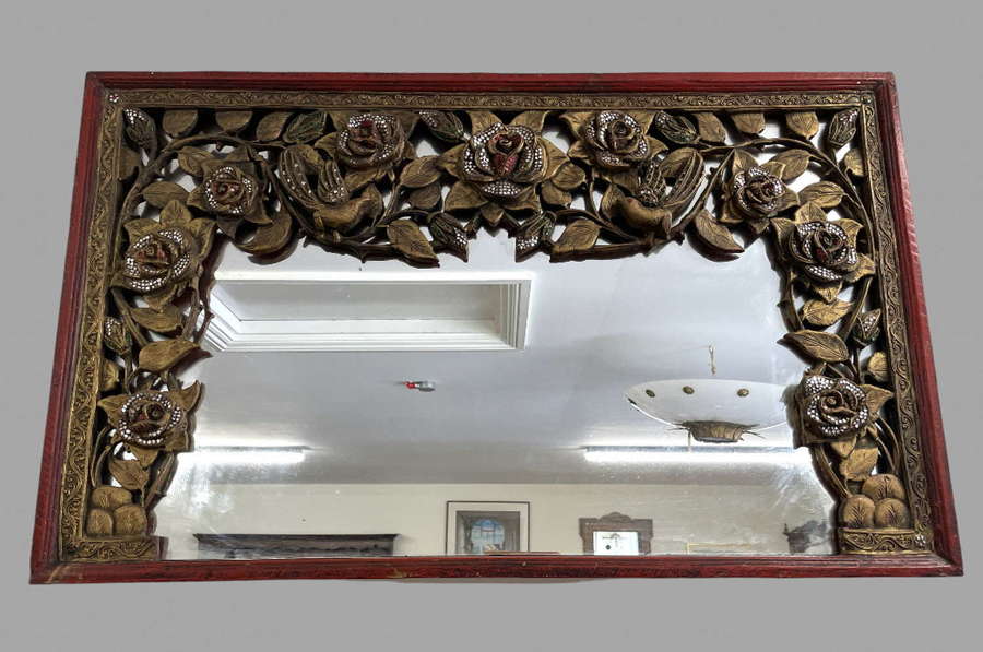 A Highly Decorated Asian Wall Mirror