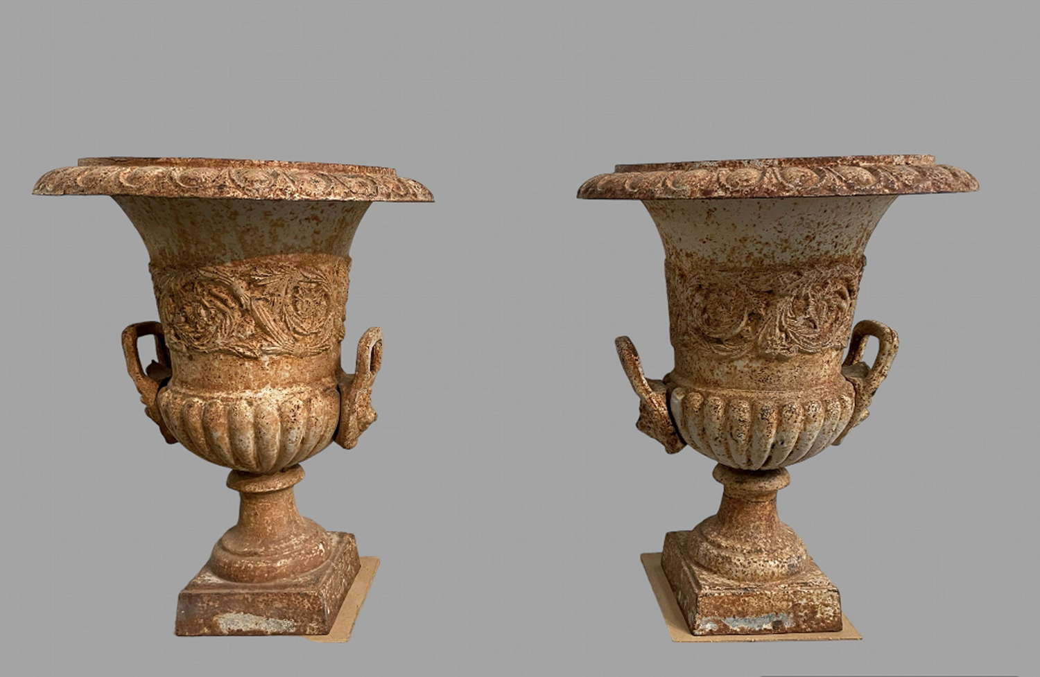 A Pair of Cast Iron Urns