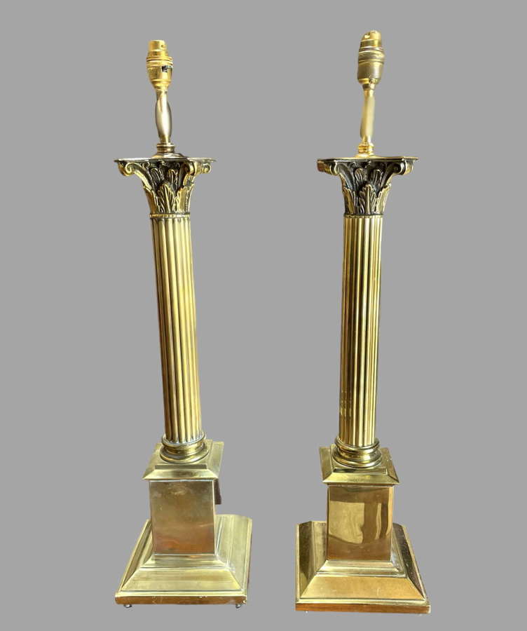 A pair of Brass Corinthian Lamps
