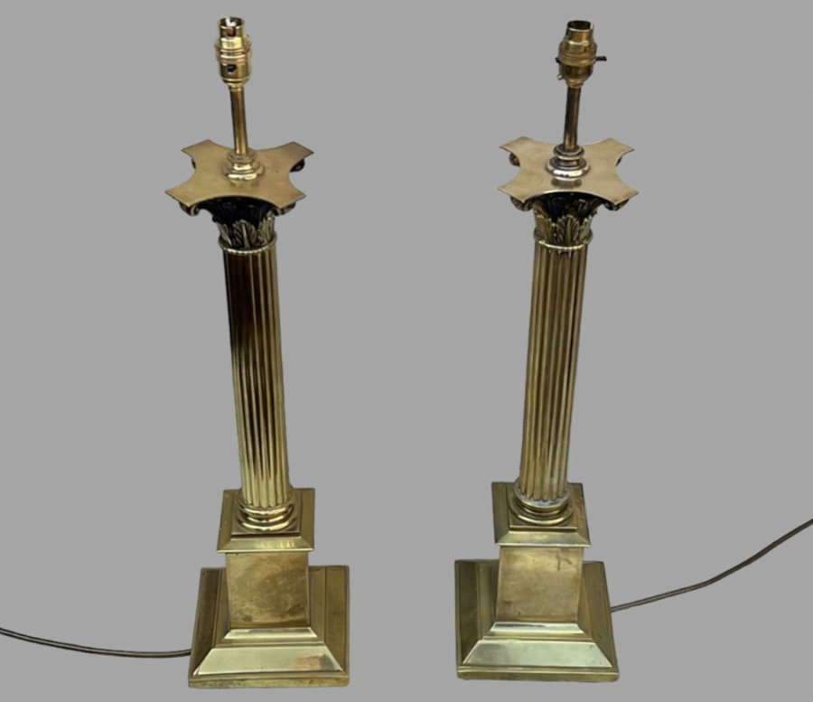 A Pair Of Brass Corinthian Lamps