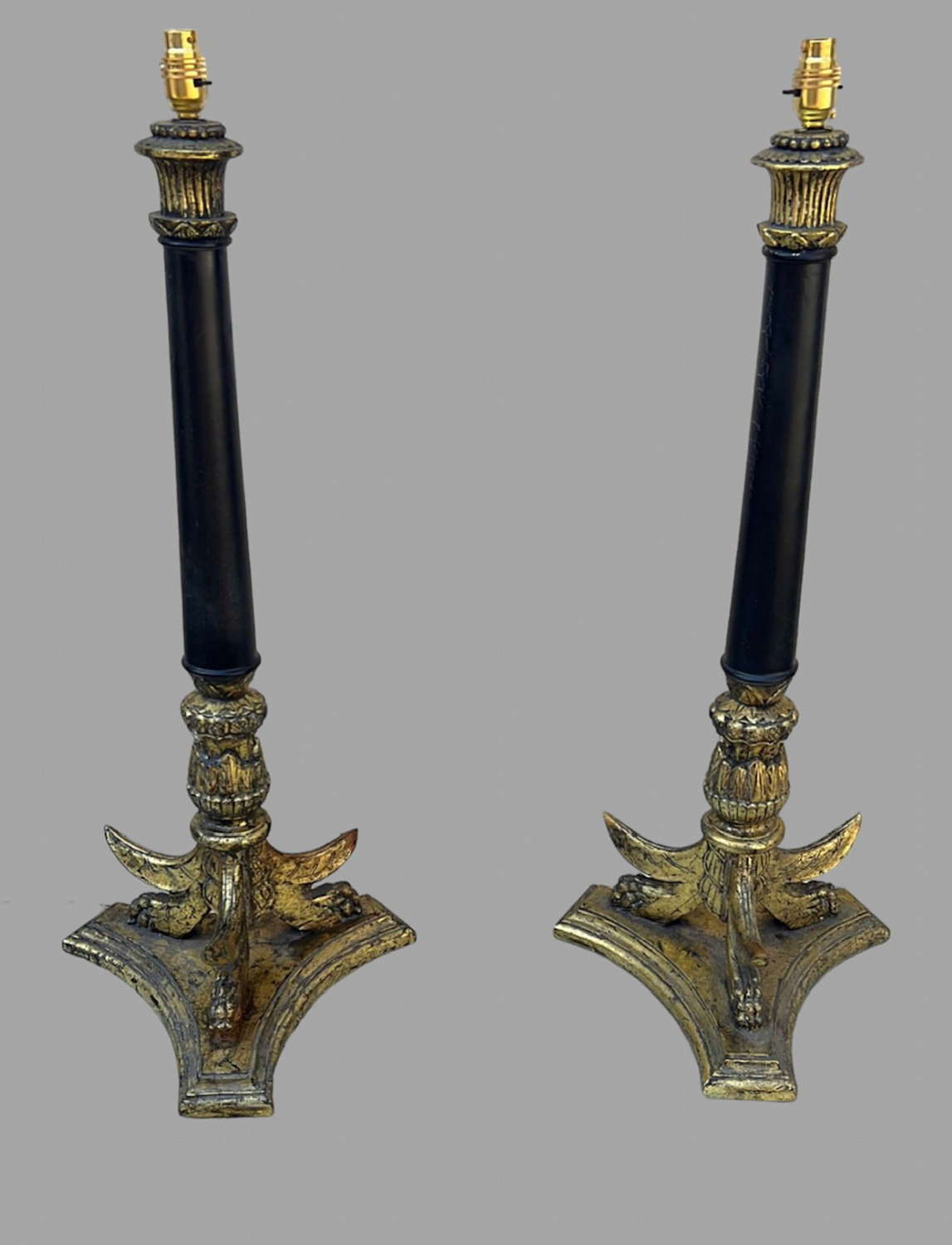 A Pair of Black and Gilded Table Lamps