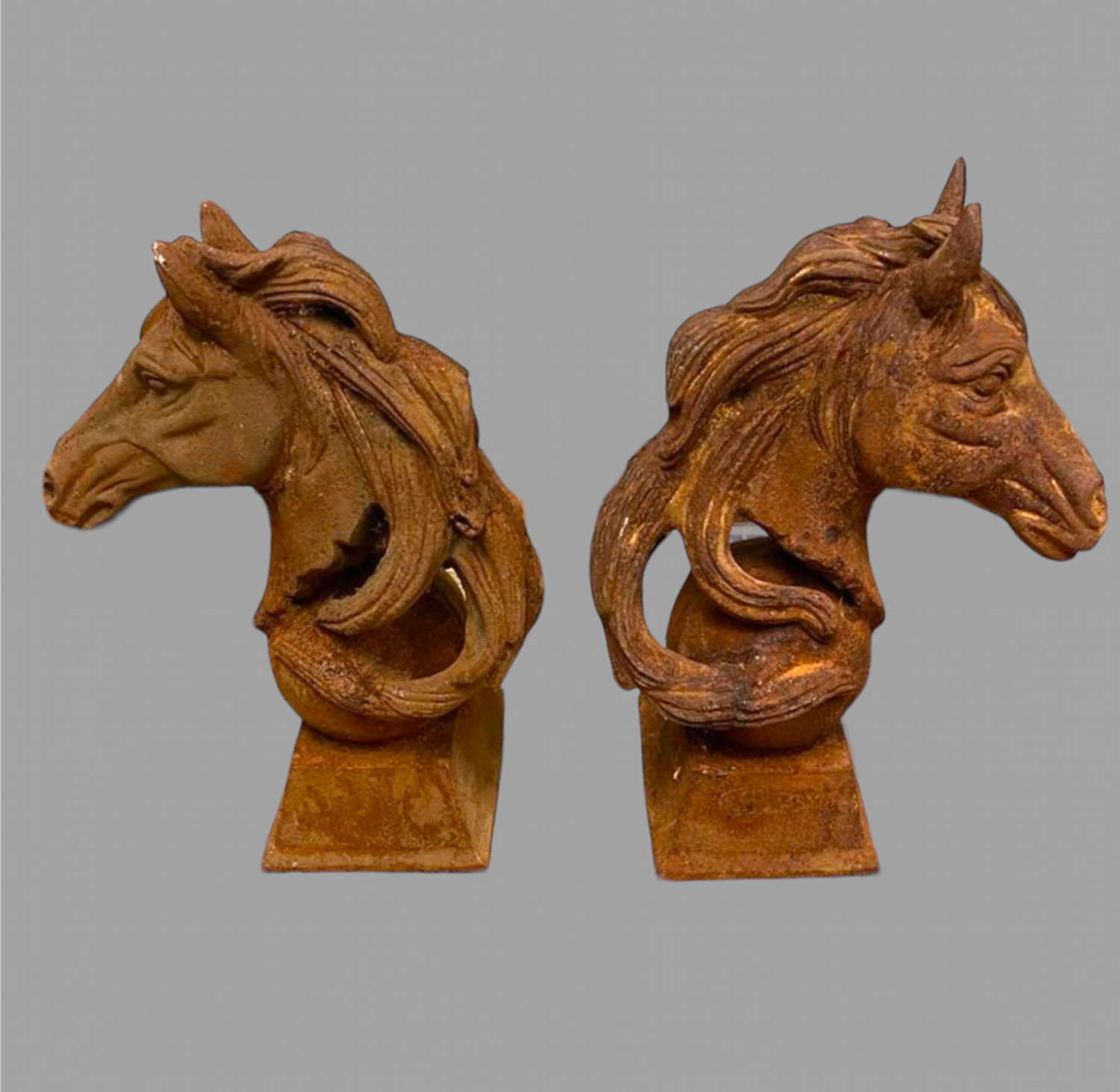 A Near Pair of Horse's Head in Cast Iron