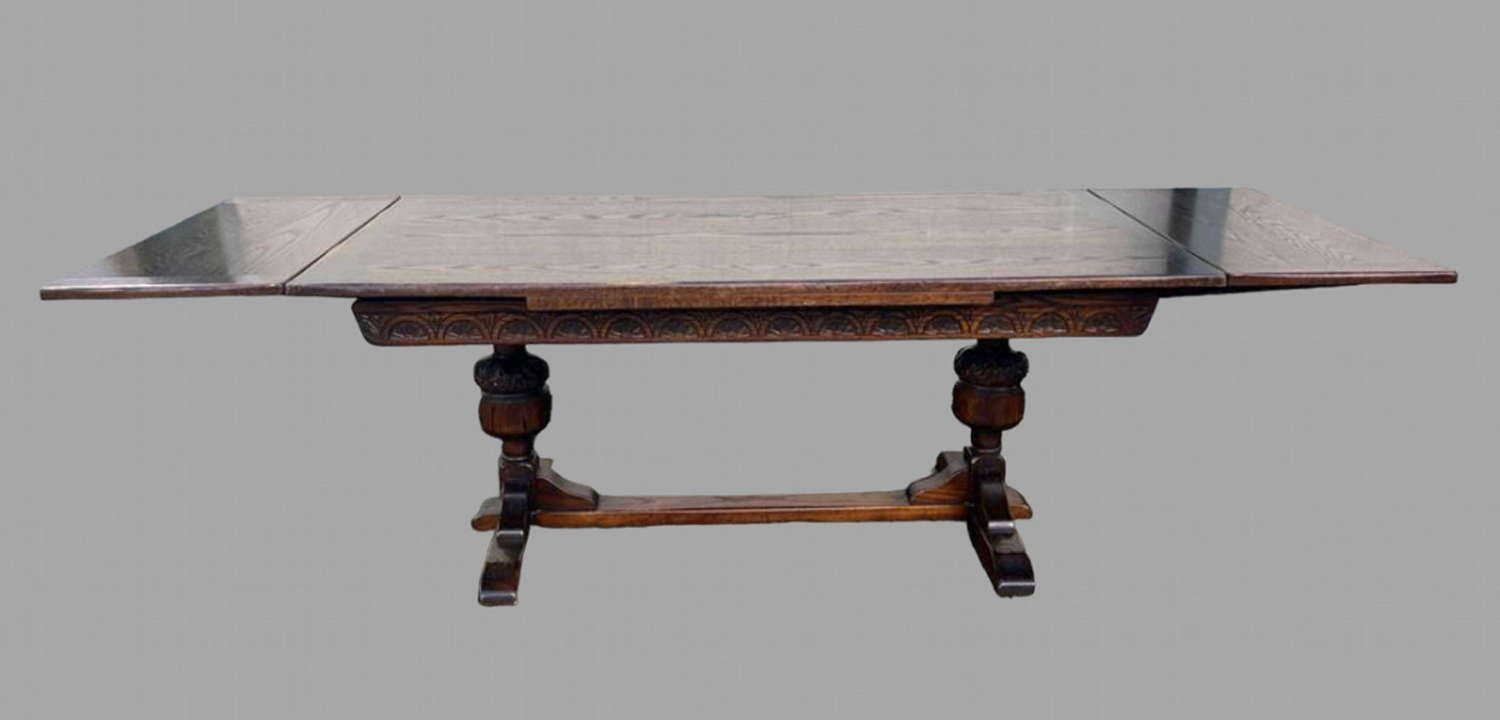 A Jacobean Style Oak Draw Leaf Dining Table