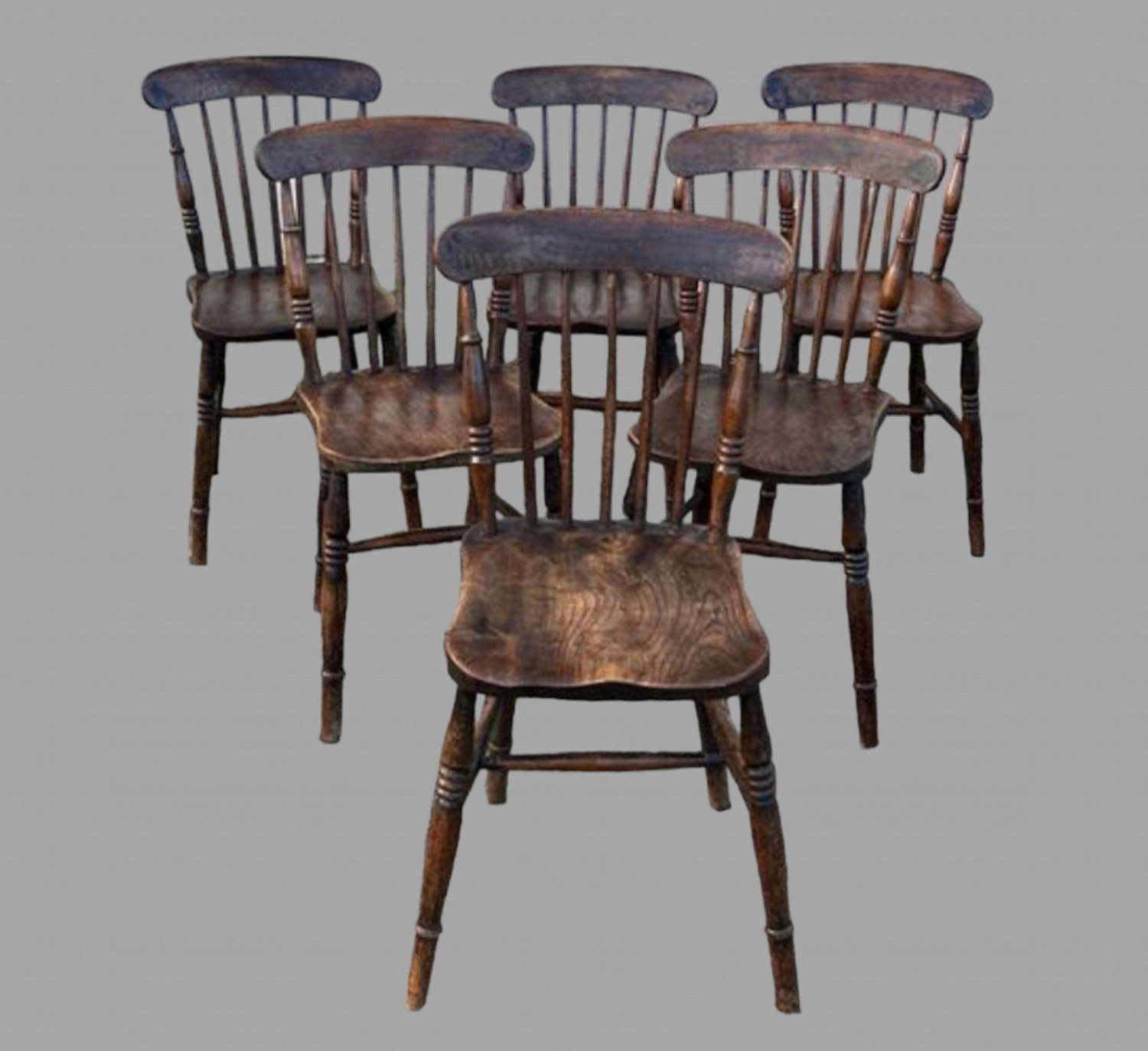 A Set of Late 19th Elm Seated Stickback Country Dining Chairs