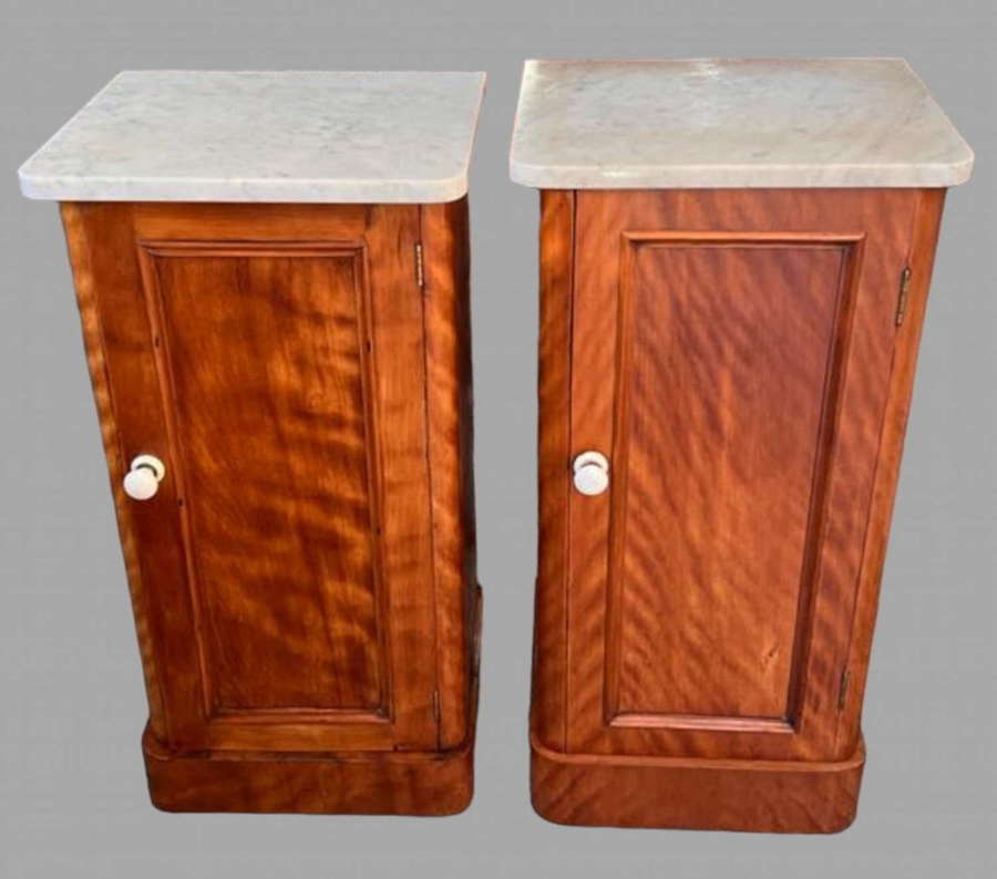 A Near Pair of Marble Topped Satinwood Bedside Tables