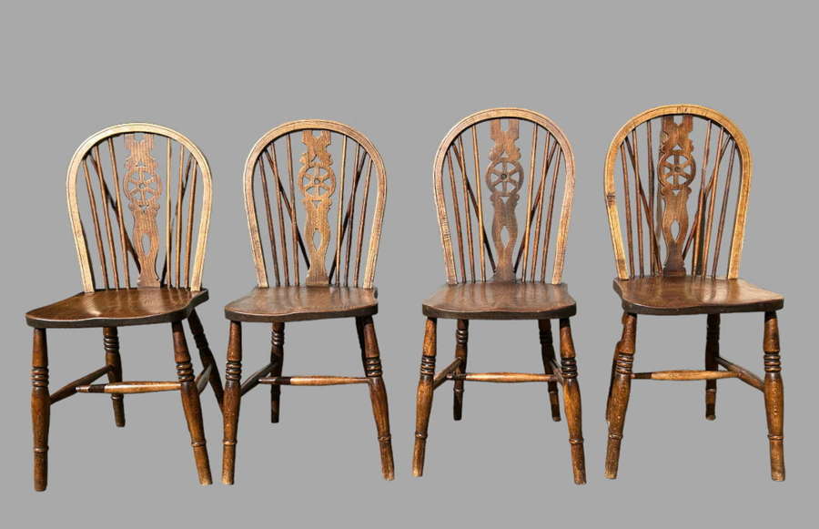A Set of Four Victorian Wheelback Dining Chairs