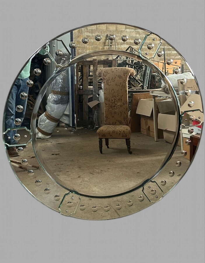 A Striking Circular Venetian Mirror with Engraved Glass Detailing