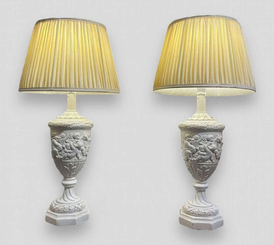 A Pair of Moulded Plaster Lamps with Shades